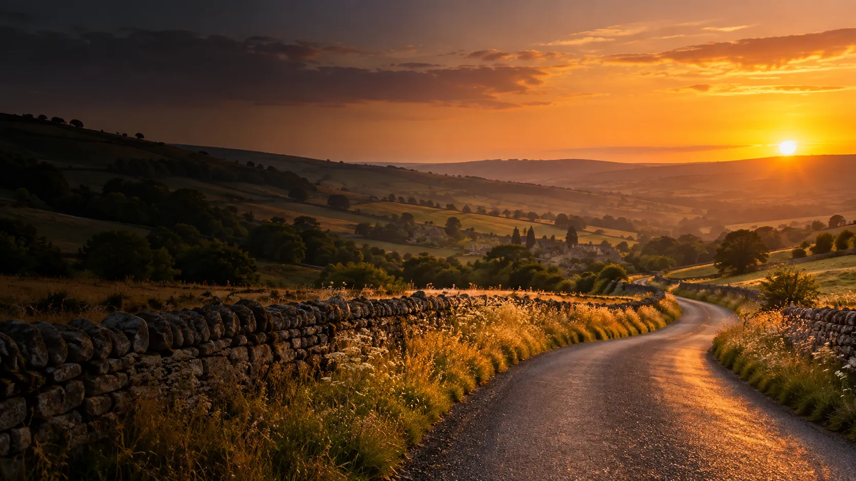 Road through rolling English countryside at sunset